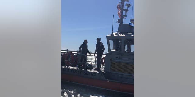The man was clinging to wooden debris off the Texas Gulf Coast.