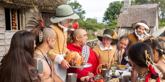 A modern recreation of the first Thanksgiving in the fall of 1621 at the Plimoth Patuxet Museums (formerly Plimoth Plantation) in Plymouth, Massachusetts.  Only half of the Mayflower's passengers, around 50, survived the first winter in Plymouth - while at least 90 Wampanoags attended the feast, according to pilgrim Edward Winslow, who offered the only contemporary account of the first Thanksgiving.