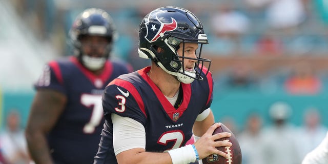 Kyle Allen #3 of the Houston Texans fights during the first quarter of the game against the Miami Dolphins at Hard Rock Stadium on November 27, 2022 in Miami Gardens, Florida.