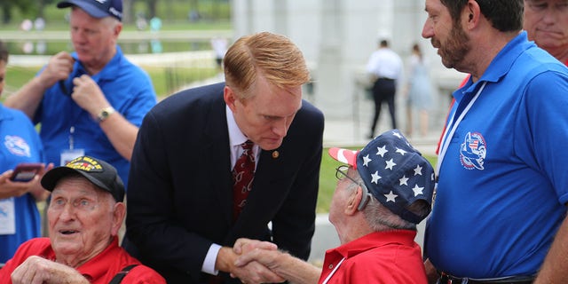 Sen. James Lankford of Oklahoma shakes the hand of an American veteran. There are many ways Americans can help each other during this Thanksgiving and holiday season. 