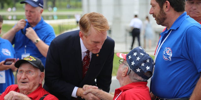 Sen. James Lankford of Oklahoma shakes the hand of an American veteran. There are many ways Americans can help each other during this Thanksgiving and holiday season.