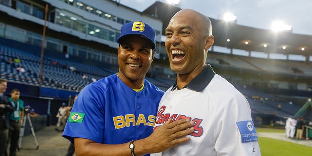 Mariano Rivera of the New York Yankees, right, talks with manager Barry Larkin of Team Brazil before Game 1 of the 2013 World Baseball Classic Qualifier against Team Panama at Rod Carew National Stadium Nov. 15, 2012, in Panama City, Panama. 