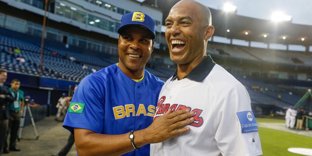 Mariano Rivera of the New York Yankees, right, talks with manager Barry Larkin of Team Brazil before Game 1 of the 2013 World Baseball Classic Qualifier against Team Panama at Rod Carew National Stadium Nov. 15, 2012, in Panama City, Panama. 