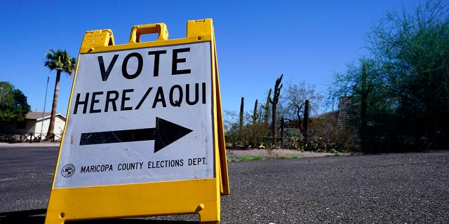 A sign in Maricopa County tells Americans where to vote in both English and Spanish.