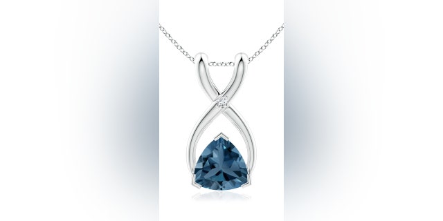 This diamond and topaz necklace is designed with a wishbone shape. 