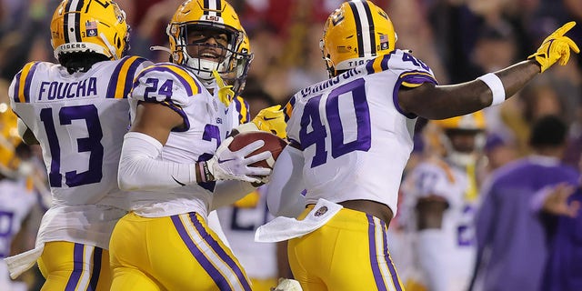 Jarrick Bernard-Converse #24 of the LSU Tigers celebrates and interception during the first half against the Alabama Crimson Tide at Tiger Stadium on November 05, 2022 in Baton Rouge, Louisiana. 