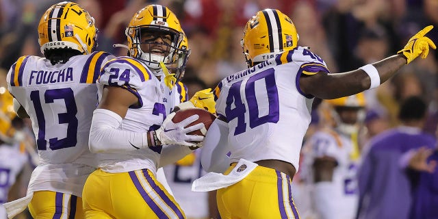 Jarrick Bernard-Converse #24 of the LSU Tigers celebrates and interception during the first half against the Alabama Crimson Tide at Tiger Stadium on November 05, 2022 in Baton Rouge, Louisiana.