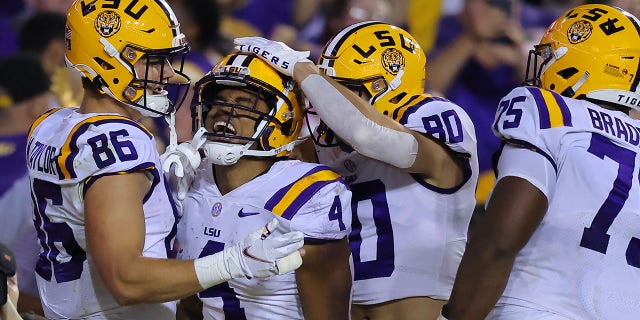 John Emery Jr. #4 of the LSU Tigers celebrates a touchdown during the first half against the Alabama Crimson Tide at Tiger Stadium on November 05, 2022 in Baton Rouge, Louisiana.