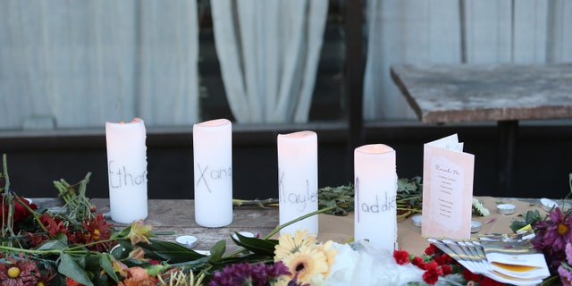 A small memorial is seen at the Mad Greek restaurant in Moscow, Idaho on Tuesday, November 15, 2022. Murder victims, Madison Mogen and Xana Kernodle worked here as servers for a couple years. The sign on door says closed due to loss.