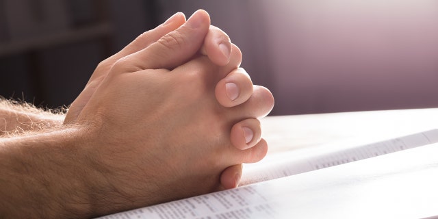 Close-up of a man praying