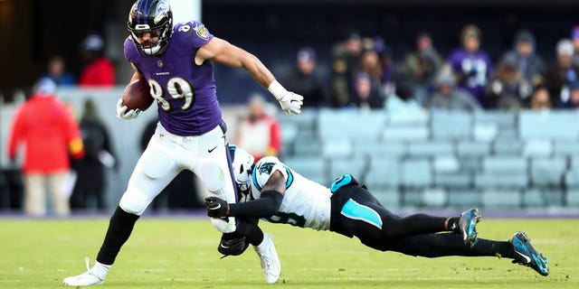 Mark Andrews (89) of the Baltimore Ravens breaks a tackle during the fourth quarter against the Carolina Panthers, Nov. 20, 2022, in Baltimore, Maryland.