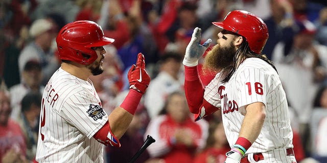 Brandon Marsh #16 of the Philadelphia Phillies (R) celebrates his home run with teammate Kyle Schwarber #12 during the second inning against the Houston Astros in Game Three of the 2022 World Series at Citizens Bank Park on November 01, 2022 in Philadelphia, Pennsylvania. 