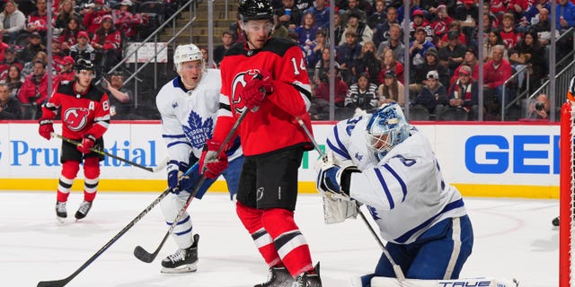 Matt Murray #30 of the Toronto Maple Leafs makes a save against Nathan Bastian #14 of the New Jersey Devils in the second period at the Prudential Center on November 23, 2022 in Newark, New Jersey.