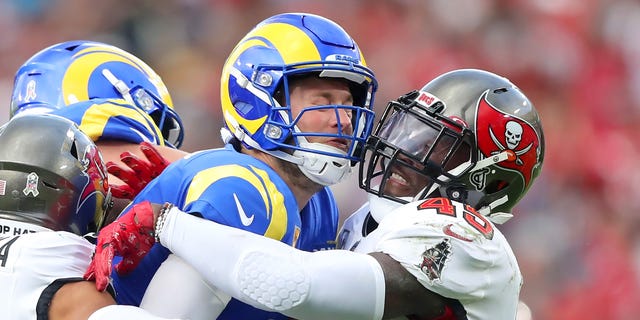 Los Angeles Rams quarterback Matthew Stafford (9) is wrapped up by Tampa Bay Buccaneers linebacker Devin White (45) during the regular season game between the Los Angeles Rams and the Tampa Bay Buccaneers on Nov. 6, 2022 at Raymond James Stadium in Tampa, Florida.