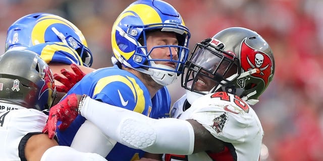 Los Angeles Rams quarterback Matthew Stafford (9) is wrapped up by Tampa Bay Buccaneers linebacker Devin White (45) during the regular season game between the Los Angeles Rams and the Tampa Bay Buccaneers on Nov. 6, 2022 at Raymond James Stadium in Tampa, Florida.
