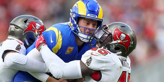 Los Angeles Rams quarterback Matthew Stafford (9) is wrapped up by Tampa Bay Buccaneers linebacker Devin White (45) during the regular season game between the Los Angeles Rams and the Tampa Bay Buccaneers on Nov. 6, 2022 at Raymond James Stadium in Tampa, Florida.