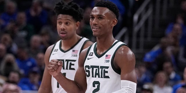 Michigan State guard Tyson Walker (2) celebrates the team's overtime win over Kentucky in an NCAA college basketball game, Tuesday, Nov. 15, 2022, in Indianapolis.