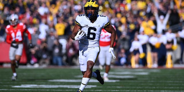 Cornelius Johnson (6) of the Michigan Wolverines runs with the ball during the second quarter of a game against the Ohio State Buckeyes at Ohio Stadium Nov. 26, 2022, in Columbus, Ohio. 