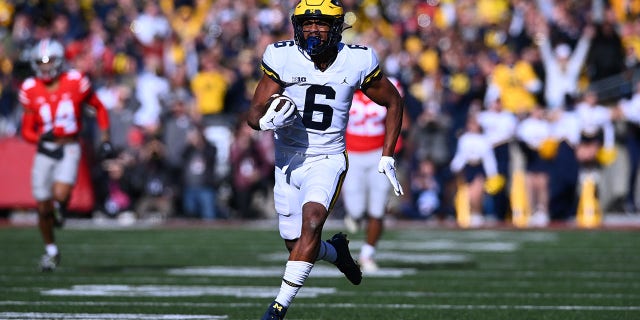 Cornelius Johnson (6) of the Michigan Wolverines runs with the ball during the second quarter of a game against the Ohio State Buckeyes at Ohio Stadium Nov. 26, 2022, in Columbus, Ohio. 