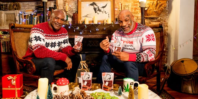 Former heavyweight champions Mike Tyson and Evander Holyfield show off "Holy Ears," their THC infused edible. 