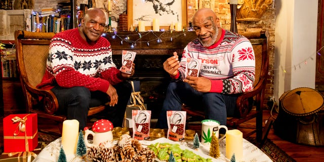 Former heavyweight champions Mike Tyson and Evander Holyfield show off