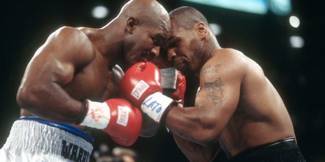Evander Holyfield and Mike Tyson fight for WBA World Heavyweight Title on June 28, 1997 at the MGM Grand Garden in Las Vegas. The Fight was stop in the third round and Tyson was disqualified for biting Holyfield on both ears.
