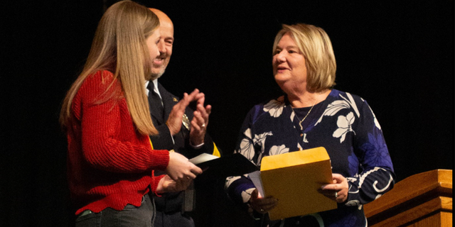 Excelsior Springs Mayor Sharon Powell presents Ava Donegan with award. 