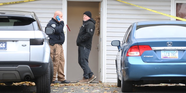 Police at the front of the house in Moscow, Idaho, Monday, Nov. 14, 2022, where four University of Idaho students were killed over the weekend in an apparent quadruple homicide.
