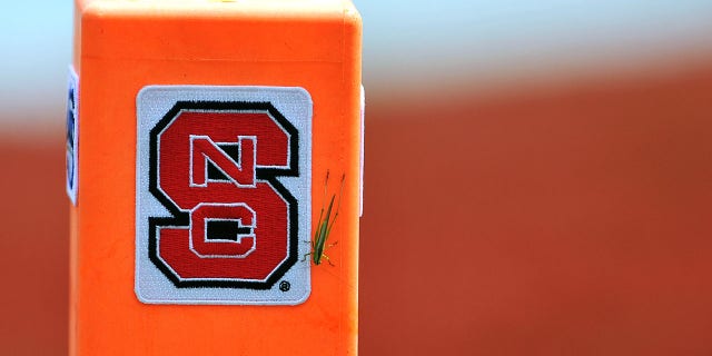 A field marker with the North Carolina State Wolfpack logo and a grasshopper during a game at Carter-Finley Stadium Aug. 30, 2014, Raleigh, N.C.