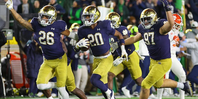 Benjamin Morrison #20 of the Notre Dame Fighting Irish celebrates an interception with teammates against the Clemson Tigers during the second half at Notre Dame Stadium on November 05, 2022 in South Bend, Indiana.