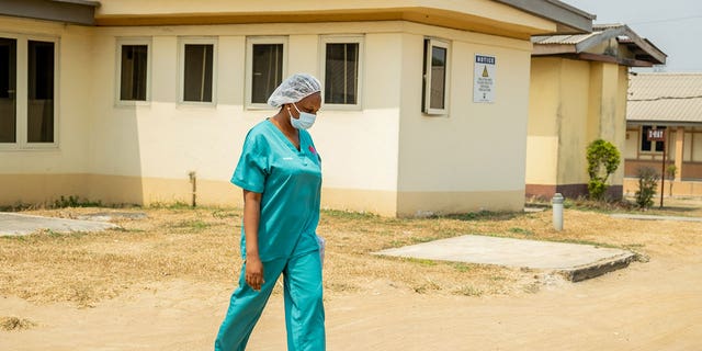 A nurse walks around the Lagos Mainland Hospital in Lagos, Nigeria, on Jan. 21, 2022. 