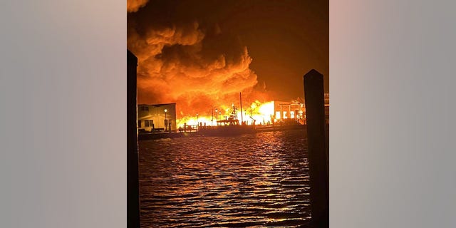 Smoke billowing from a fire at the Old Mystic marina.