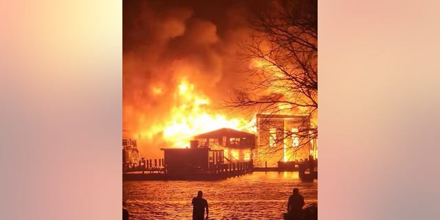 Old Mystic marine engulfed in flames. 