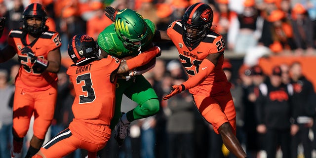 Defensive back Jaydon Grant, #3 of the Oregon State Beavers, makes a tackle during the first half of the game against the Oregon Ducks at Reser Stadium on Nov. 26, 2022 in Corvallis, Oregon. 