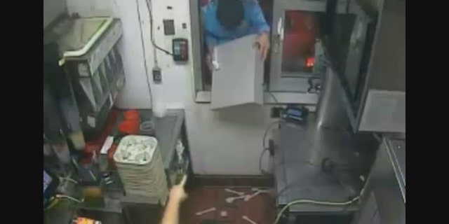 The suspect yanked the cash register through the drive-thru window and fled with three other individuals inside a red SUV.