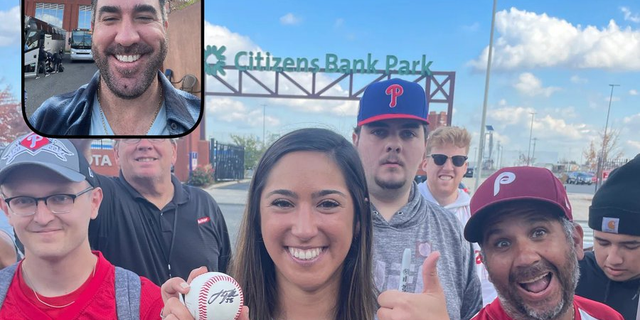 Phillies fan Stephanie Di Ianni poses with a signed Justin Verlander baseball before Game 3 of the World Series in Philadelphia, Pa. 