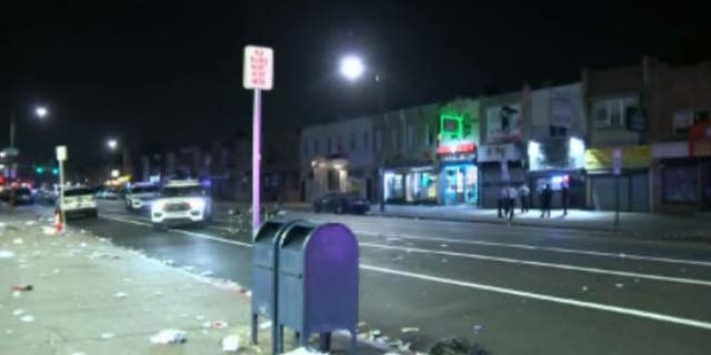 Trash lines roads outside businesses in Philadelphia's Kensington neighborhood after a mass shooting Saturday night.
