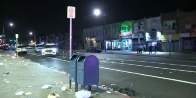 Trash lines the roads outside of businesses in Philadelphia's Kensington neighborhood after a mass shooting Saturday night.