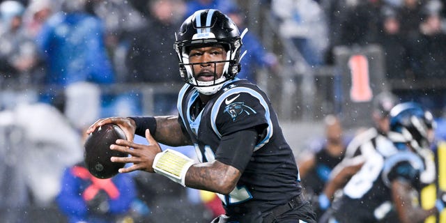 #11 PJ Walker of the Carolina Panthers passes in the first quarter against the Atlanta Falcons at Bank of America Stadium. 