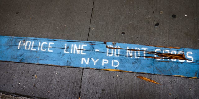 "Police Line - Do Not Cross NYPD" A sign is seen on a street in New York, on October 25, 2022.