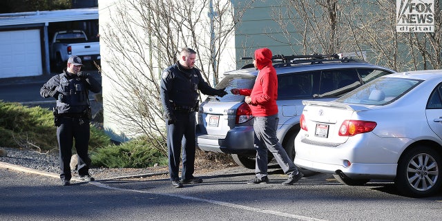 Police in Idaho talk to a man.