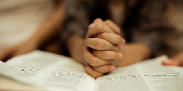praying over Bible