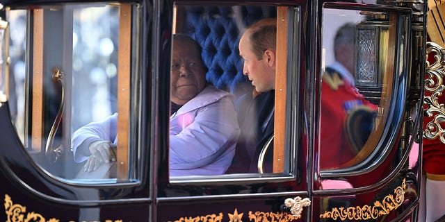 South Africa's Foreign Minister Naledi Pandor and Prince William travel in state carriage.