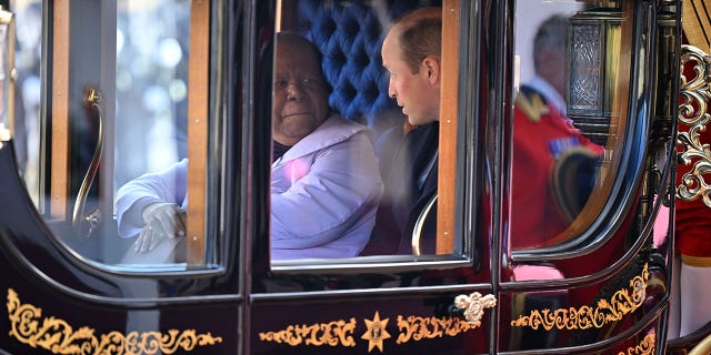 South Africa's Foreign Minister Naledi Pandor and Prince William travel in state carriage.