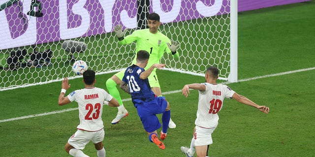 Christian Pulisic of the United States scores the team's first goal during the FIFA World Cup Qatar 2022 Group B match between IR Iran and USA at Al Thumama Stadium on November 29, 2022, in Doha, Qatar.