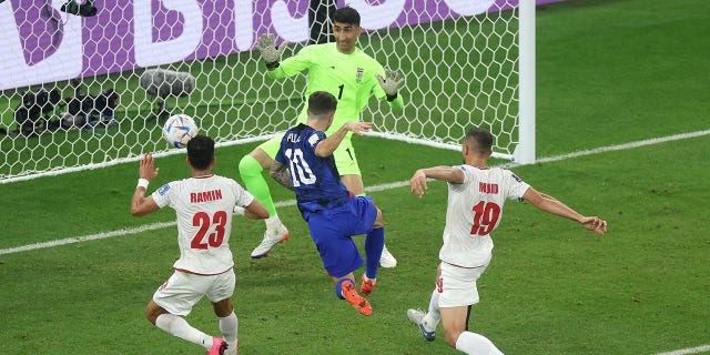 Christian Pulisic of the United States scores during the FIFA World Cup Qatar 2022 Group B match against Iran at Al Thumama Stadium on November 29, 2022 in Doha, Qatar.