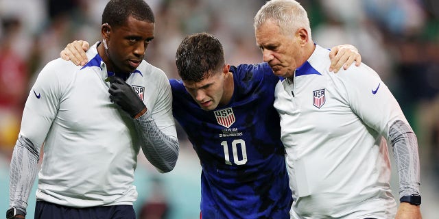 Christian Pulisic of the United States receives medical treatment after scoring a goal during a Qatar 2022 FIFA World Cup Group B match against Iran at Al Thumama Stadium on November 29, 2022 in Doha, Qatar.