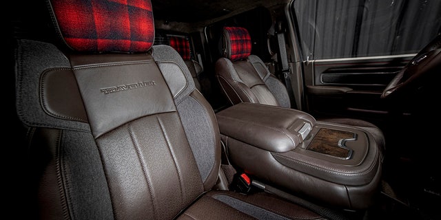 The interior features buffalo plaid inserts.