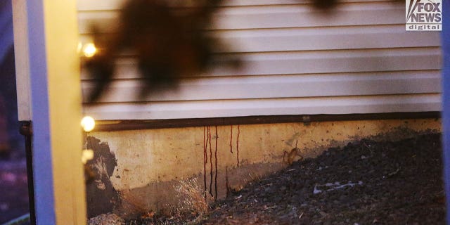 General views of the house on November 16, 2002, where four students of the University of Idaho were murdered show red stains running down the foundation of the house in Moscow, Idaho.