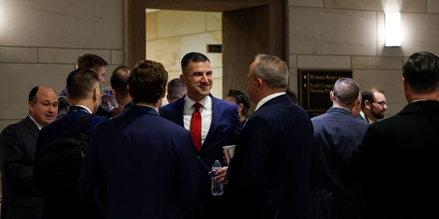 Rep.-Elect Rudy Yakym (R-IN) speaks with other newly elected lawmakers before going to an orientation meeting in the U.S. Capitol Building on November 14, 2022 in Washington, DC. 